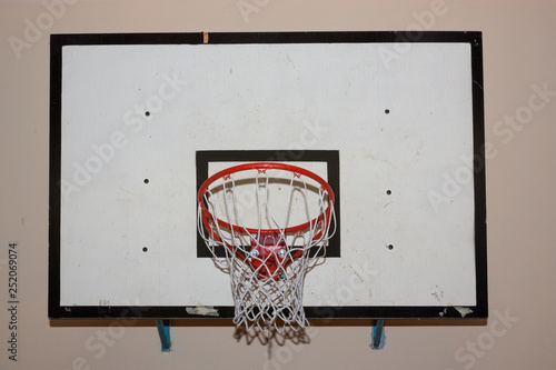 Dirty old basketball backboard in the gym. © Elena Noeva