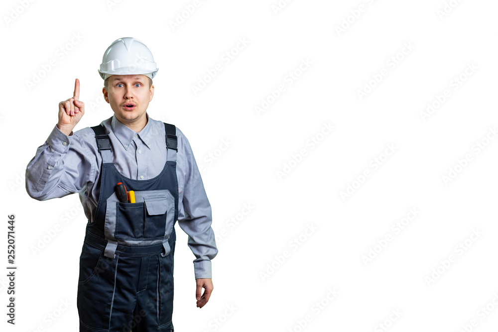 The civil engineer, pointing with his finger at the top, remembered the incredible idea of repair or construction. isolated The civil engineer, pointing with his finger at the top, remembered the incredible idea of repair or construction. isolated