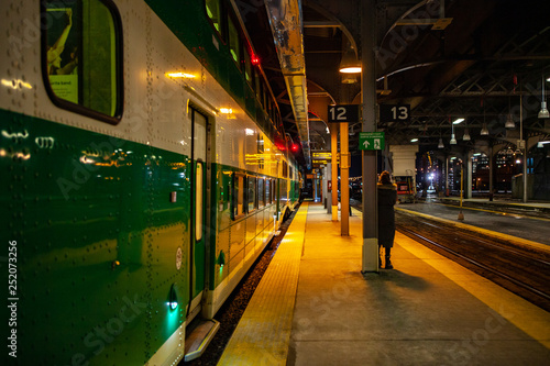 TORONTO CANADA - February 16, 2019: Green wagons of speed Toronto’s GO train at Platform of Union Station