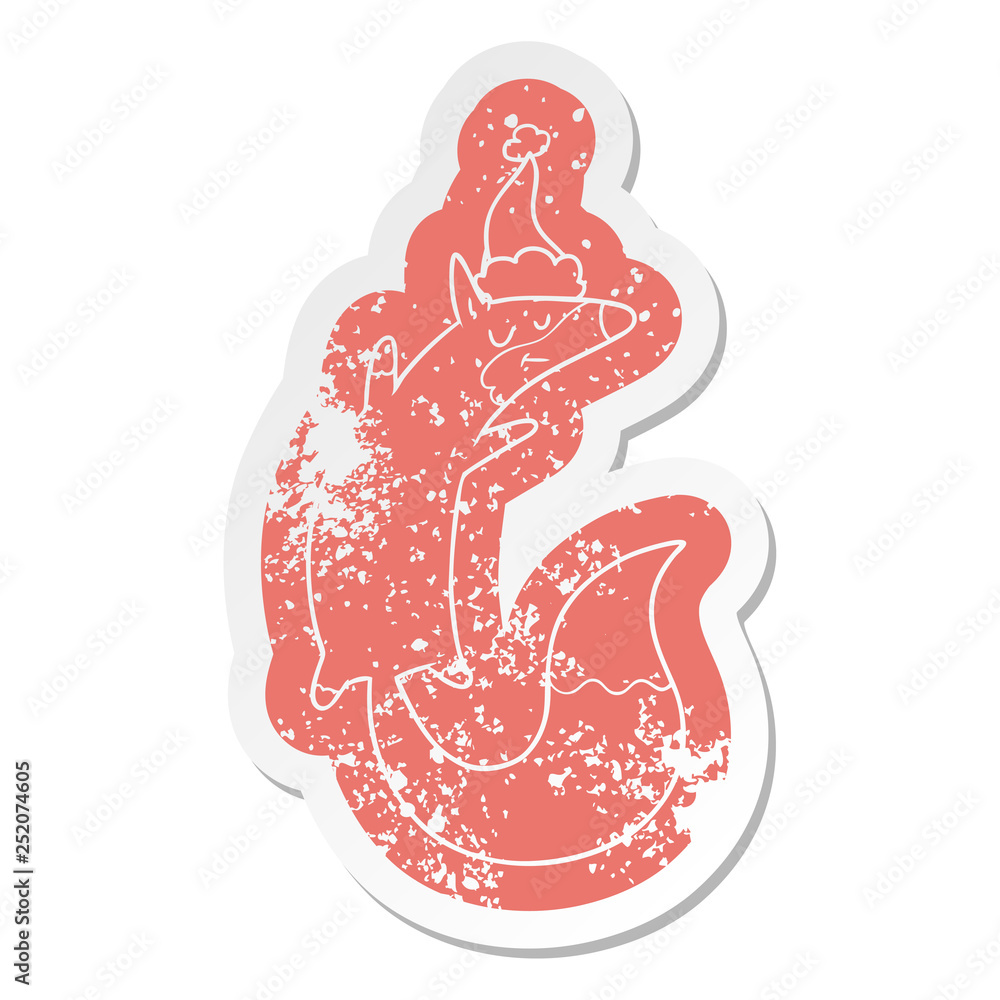 cartoon distressed sticker of a jumping fox wearing santa hat cartoon distressed sticker of a jumping fox wearing santa hat
