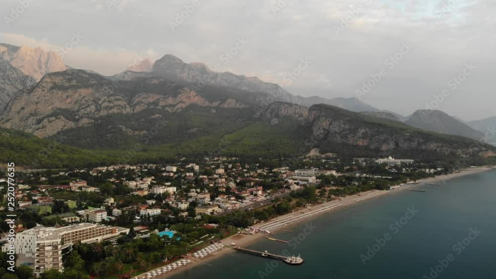 4k Aerial drone shot of Kemer coastline with turquoise water and numerous hotels at sunset 4k Aerial drone shot of Kemer coastline with turquoise water and numerous hotels at sunset
