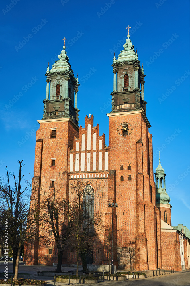 facade and towers of medieval Gothic cathedral in Poznan.