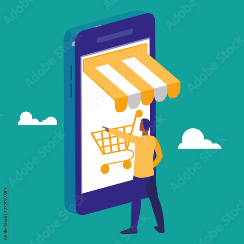 young man using smartphone with shopping cart