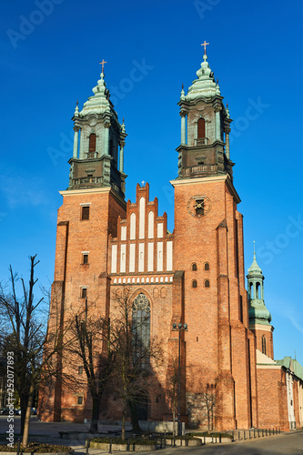facade and towers of medieval Gothic cathedral in Poznan.