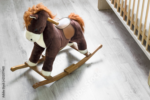 Rocking horse, crib at playroom