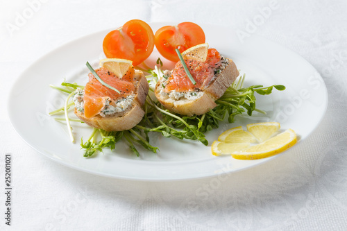 Toasts with salmon and ricotta.