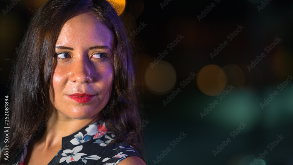 A portrait of a woman at night. A portrait of a woman at night.