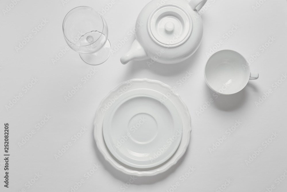 Set of clean dishes on white background top view copyspace Set of clean dishes on white background top view copyspace