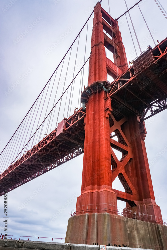 Fototapeta premium Golden Gate bridge as seen from below on a cloudy day, San Francisco