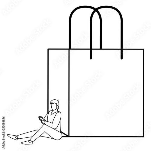young man using smartphone with shopping bag