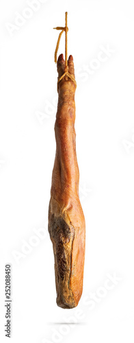 Whole leg of Spanish Iberian serrano ham hanging on a rope. Isolated on a white background