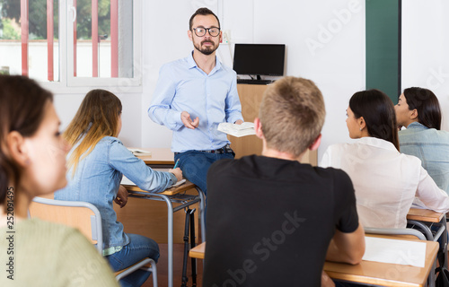 Teacher is giving lecture for students