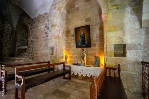 Mardin / Turkey - May 16 / 2015 : Interior view of Saint Hirmiz Chaldean church with Jesus statue and candles