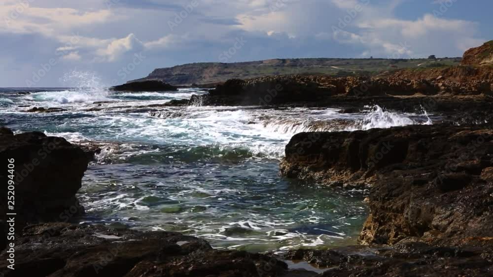 Beautiful coast of Ayia Napa, Cyprus. Big waves crashing against the stones Beautiful coast of Ayia Napa, Cyprus. Big waves crashing against the stones