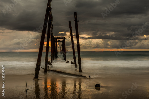 Beautiful sunset with old wooden bridge at Khao Pilai in Phang- Nga Province, Thailand