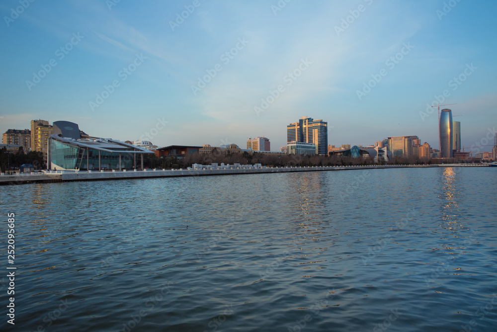 Baky skyline view from Baku boulevard the Caspian Sea embankment . Baku is the capital and largest city of Azerbaijan and of the Caucasus region. Baky skyline view from Baku boulevard the Caspian Sea embankment . Baku is the capital and largest city of Azerbaijan and of the Caucasus region.