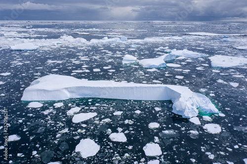 Iceberg grounded in sea ice photo