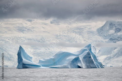 Iceberg in front of glacier