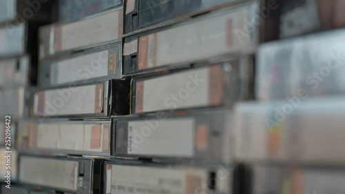 old videotapes stacked on the shelf.