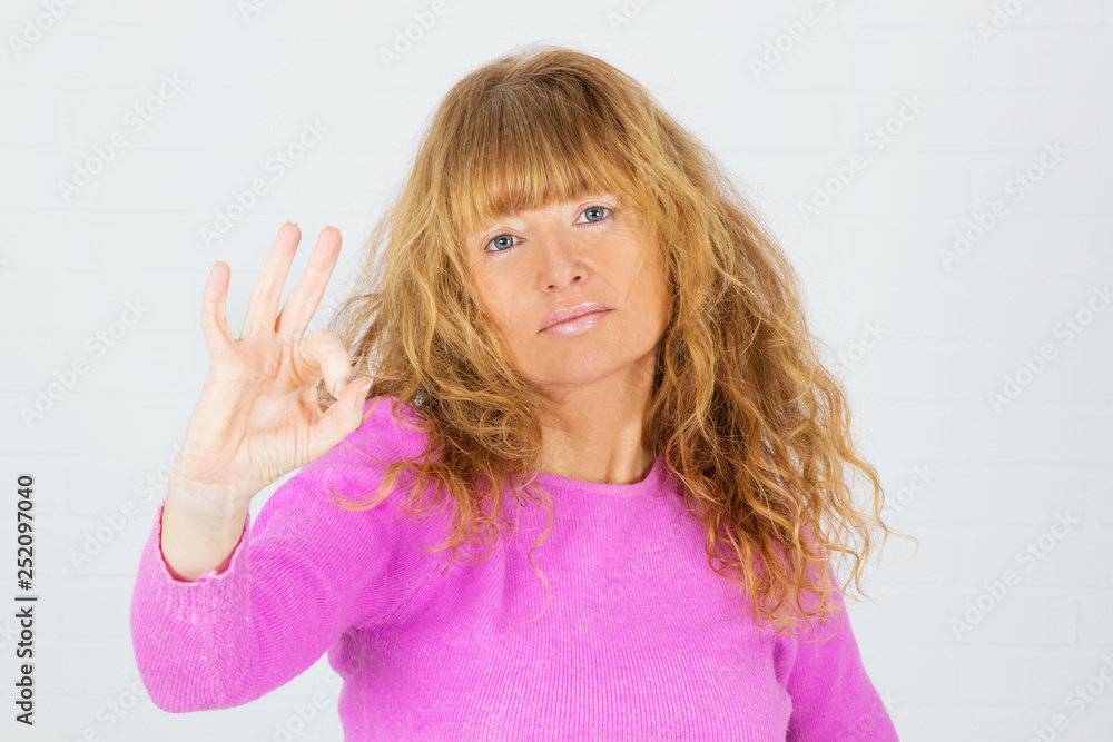 adult woman with pink jersey isolated in white background adult woman with pink jersey isolated in white background
