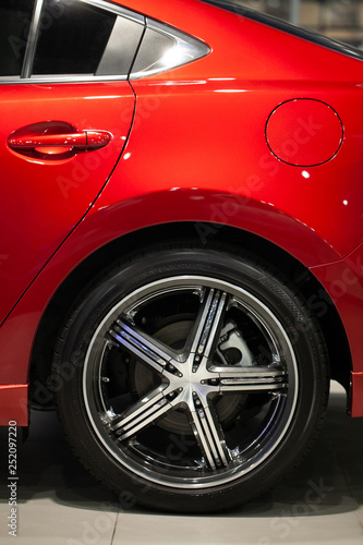 Exhibition of new car at dealer showroom. Red sportcar. Dream. Seller office. © Anton Gepolov