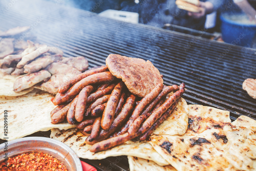 freshly grilled sausages at street food markets freshly grilled sausages at street food markets