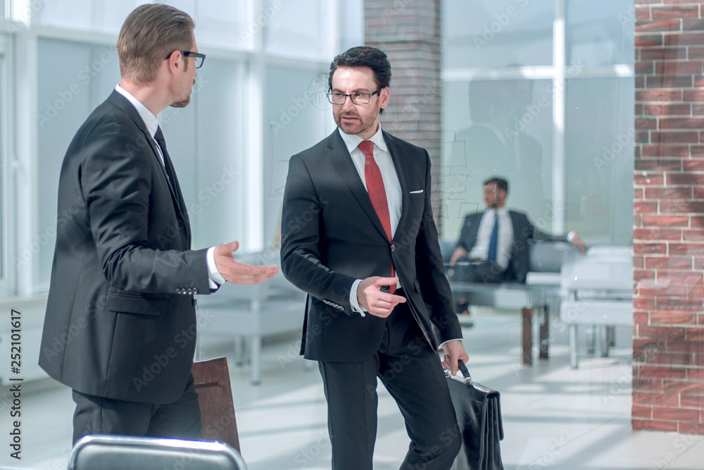 Manager meets the client at the Bank office.
