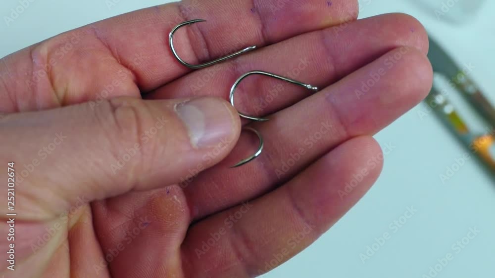 fisherman is using fishing line scissors, fisherman is using fishing line scissors,