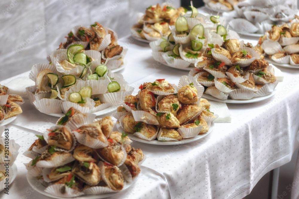 catering banquet table. many tasty snacks. selective focus. soft blurred. toned catering banquet table. many tasty snacks. selective focus. soft blurred. toned