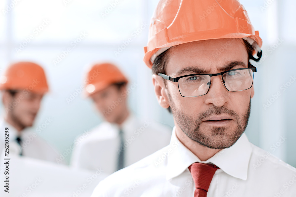 close up.portrait of confident architect on blurred background close up.portrait of confident architect on blurred background