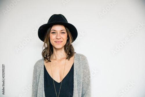 Portrait of a beautiful woman, wearing a hat photo