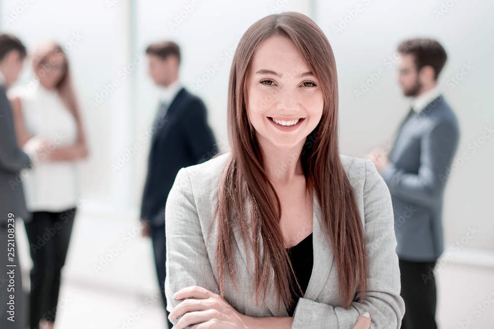 young businesswoman on a blurred background of the office young businesswoman on a blurred background of the office