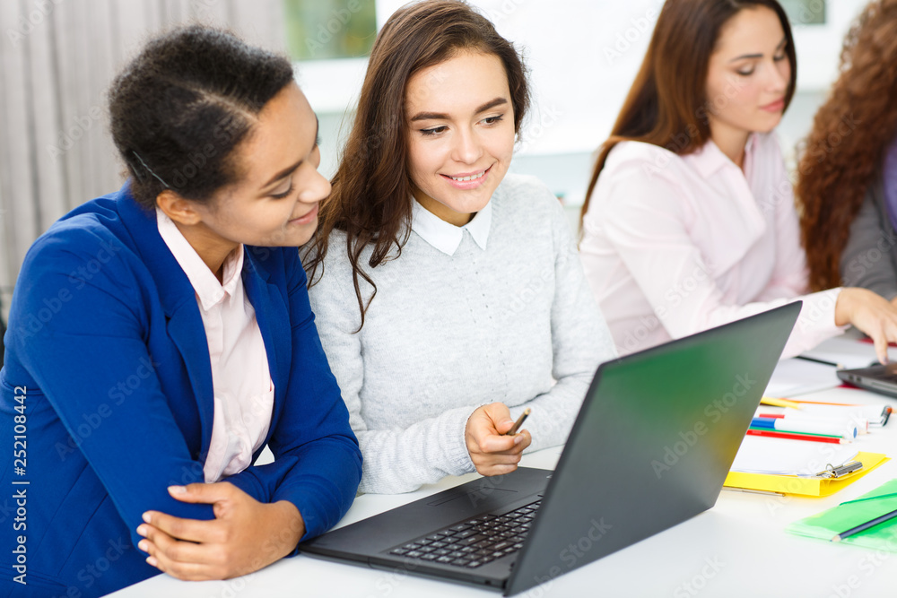 Female colleagues having a meeting of their business team Female colleagues having a meeting of their business team