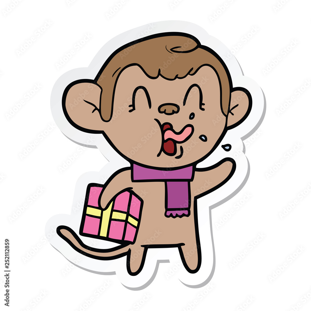 sticker of a crazy cartoon monkey with christmas present sticker of a crazy cartoon monkey with christmas present