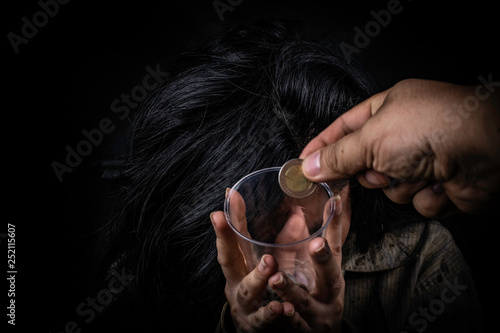 Dirty beggar asking for some money homeless concept on black background