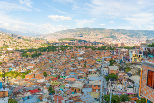 aerial view of Comuna or slum in Medellin Colombia. Comuna 13 is known for escalators between streets and Colourful buildings. Dangerous and poor Favela
