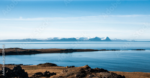 Relaxing landscape to calm down and relieve stress, blue lake with serene and calm waters in the middle of wild nature.