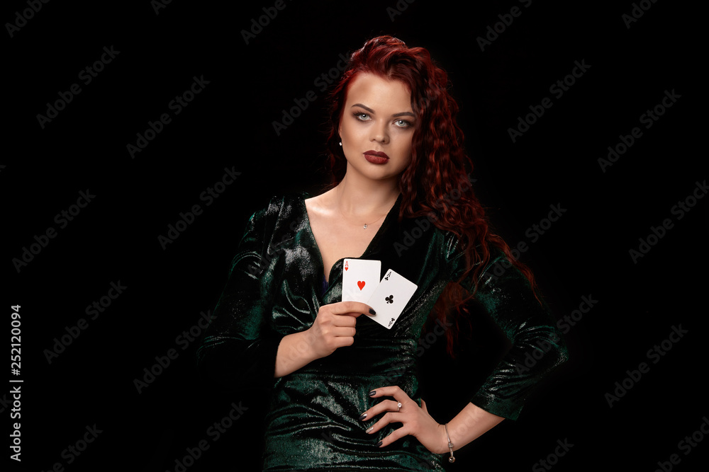 Young beautiful woman with a playing cards over black. Casino