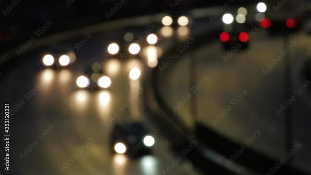 Night time in the city. Out of focus with blurry unfocused city lights and traffic bokeh. Night time in the city. Out of focus with blurry unfocused city lights and traffic bokeh.