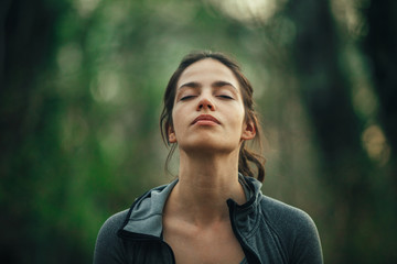 Young beautiful woman exercise in the forest