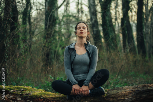 Young beautiful woman exercise in the forest