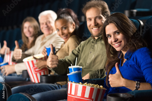 Multi ethnic group of mature people relaxing at the movie theatre