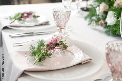 Floral decoration for wedding ceremony romance dining. Wedding banquet   festive decor. Bouquet from spring and summer flowers. Table layout. Restaurant interior. Concept of service and catering.