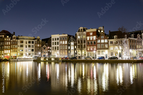 Canals at night in Amsterdam (Netherlands). March 2015. Landscape format.