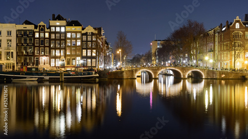 Canals at night in Amsterdam (Netherlands). March 2015. Landscape format.