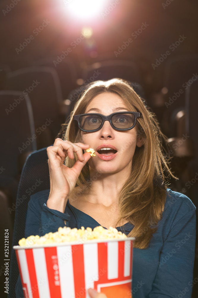 Attractive mature woman at the movies alone