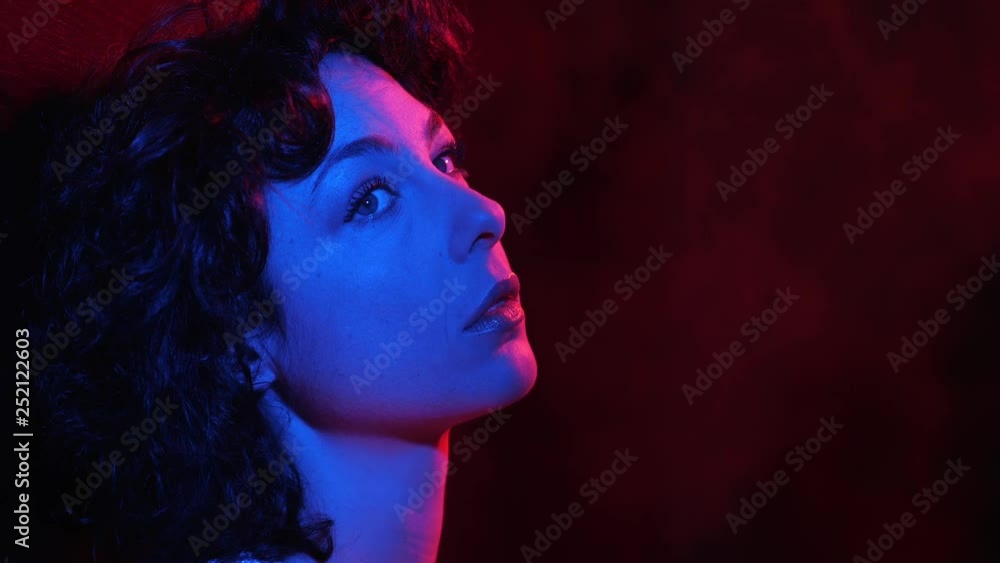 Thoughtful lonely attractive woman thinking in the dark Thoughtful lonely attractive woman thinking in the dark