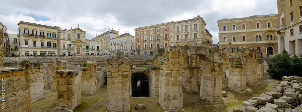 LECCE, APULIA,ITALY - MARCH 30, 2018: Panoramic view of the majestic Roman amphitheater of Lecce built during the augustan age and discovered by the archeologist Cosimo De Giorgi in Lecce town, Puglia