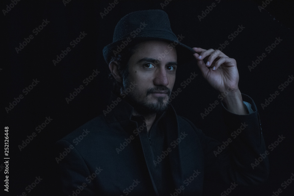 dark portrait of a young man with hat dark portrait of a young man with hat