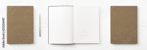 brown notebook and pen on white background
